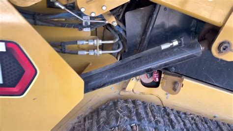 how to drain hydraulic oil on cat skid steer|cat 259d hydraulic drain.